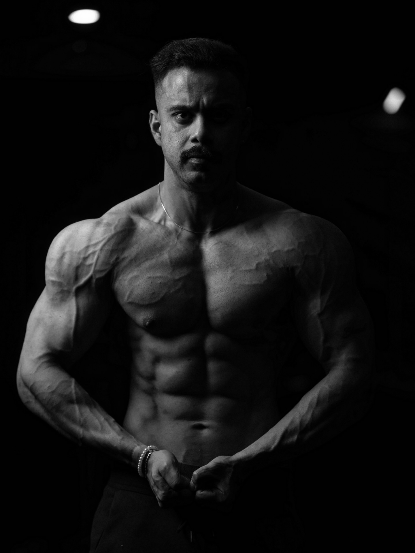 Syed Abdul Haseeb, conditioned and posing under dramatic light